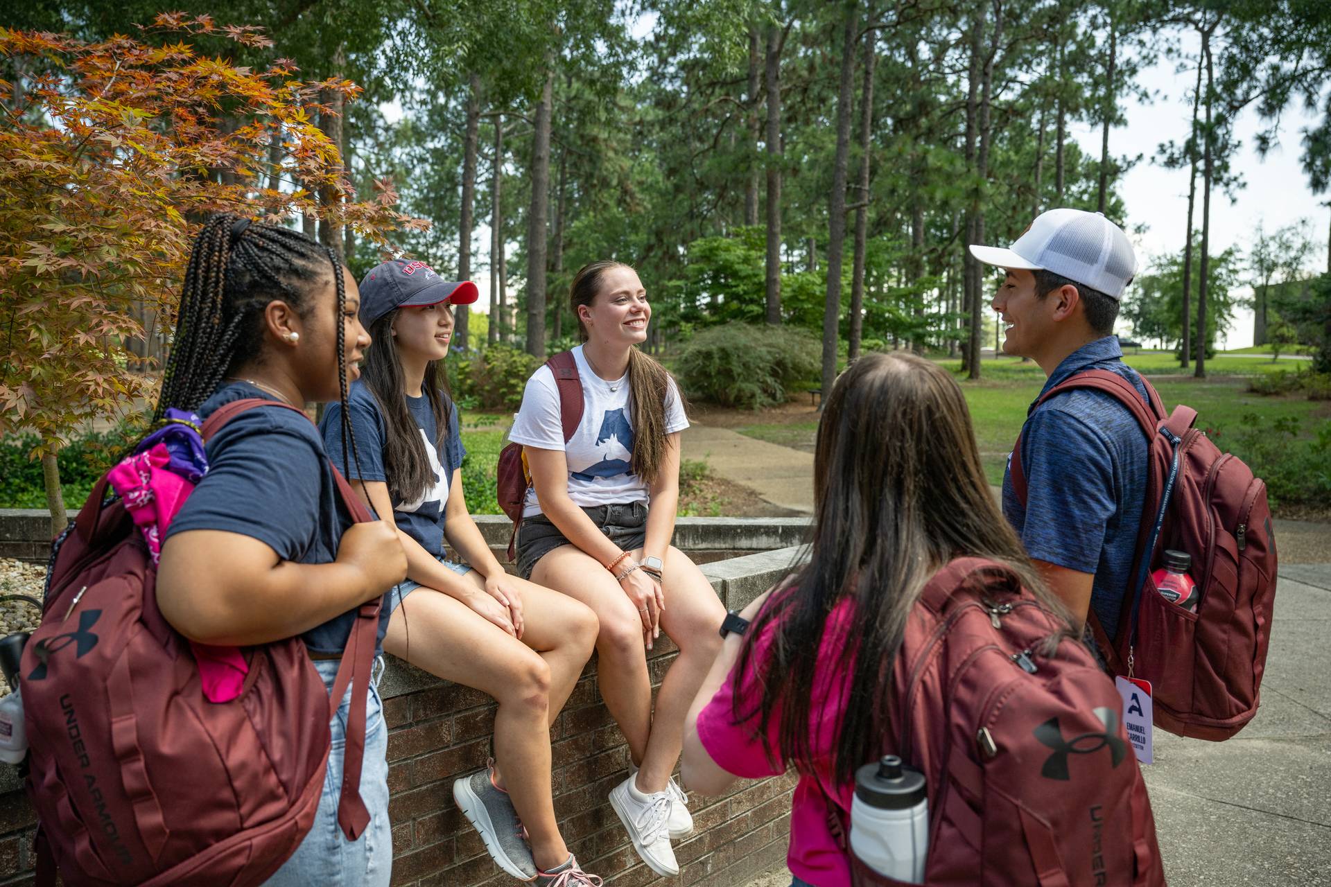 Photos of students conversing on the quad